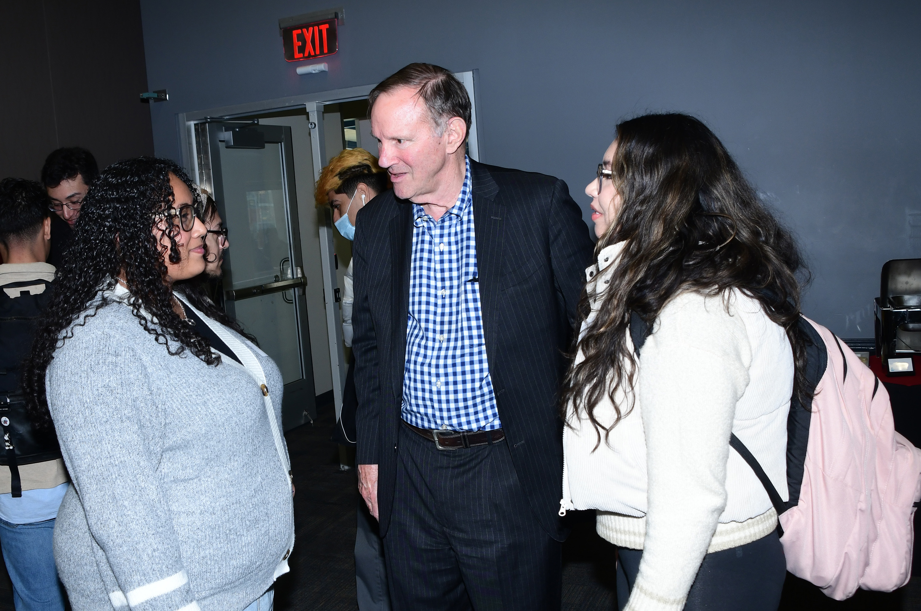 Don Graham, TheDream.US cofounder, chats with Jahaira Gonzalez (l) and Tania Ortega at the Dec. 3 event.