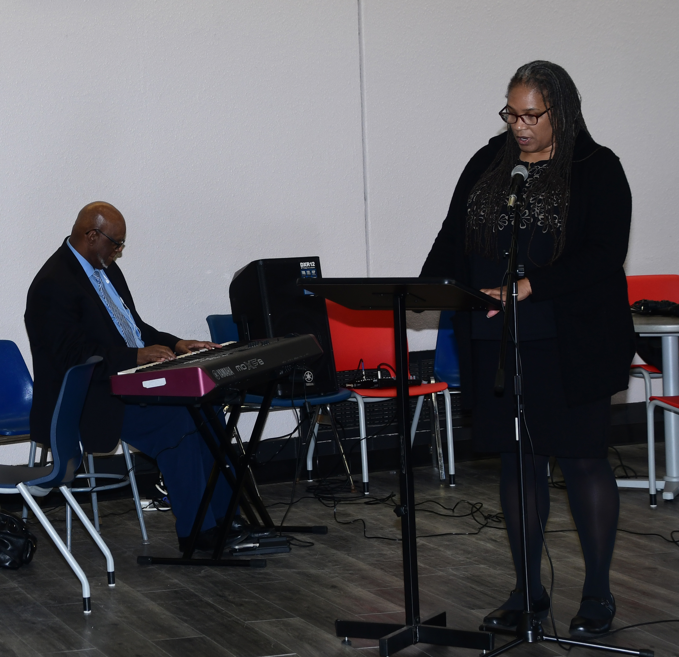 Dr. Adenike Davidson reads a selected poem.