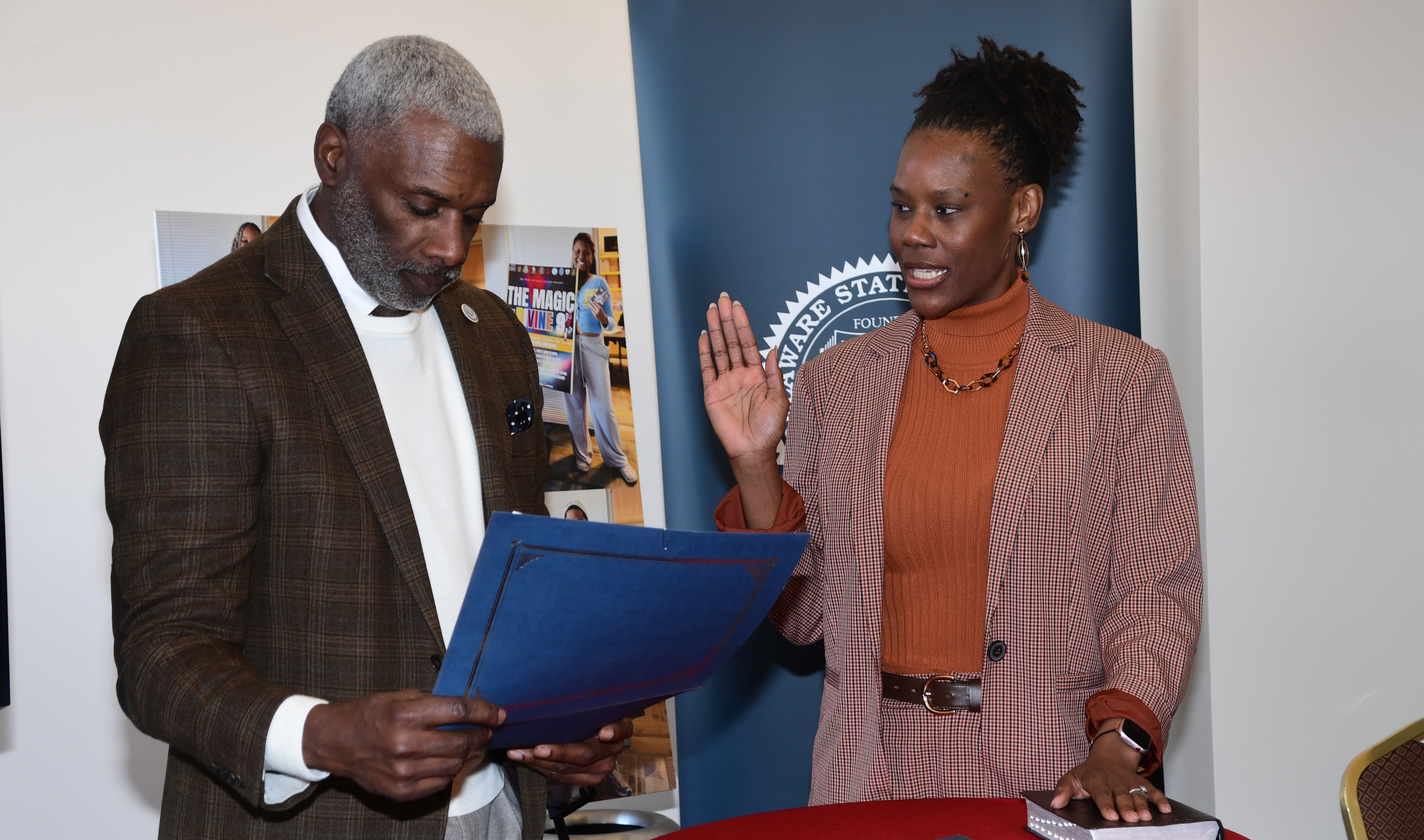 Tetra Shockley takes the Trustees' oath as administered by Board Chair Leroy Tice.