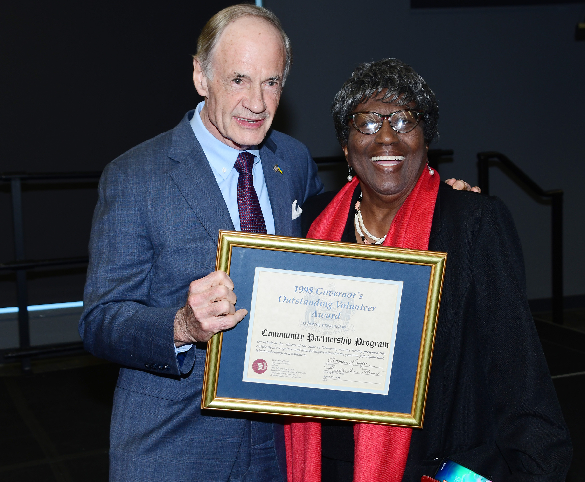 DSU Alumna brought a 1998 award to the event that then-Gov. Carper presented her.