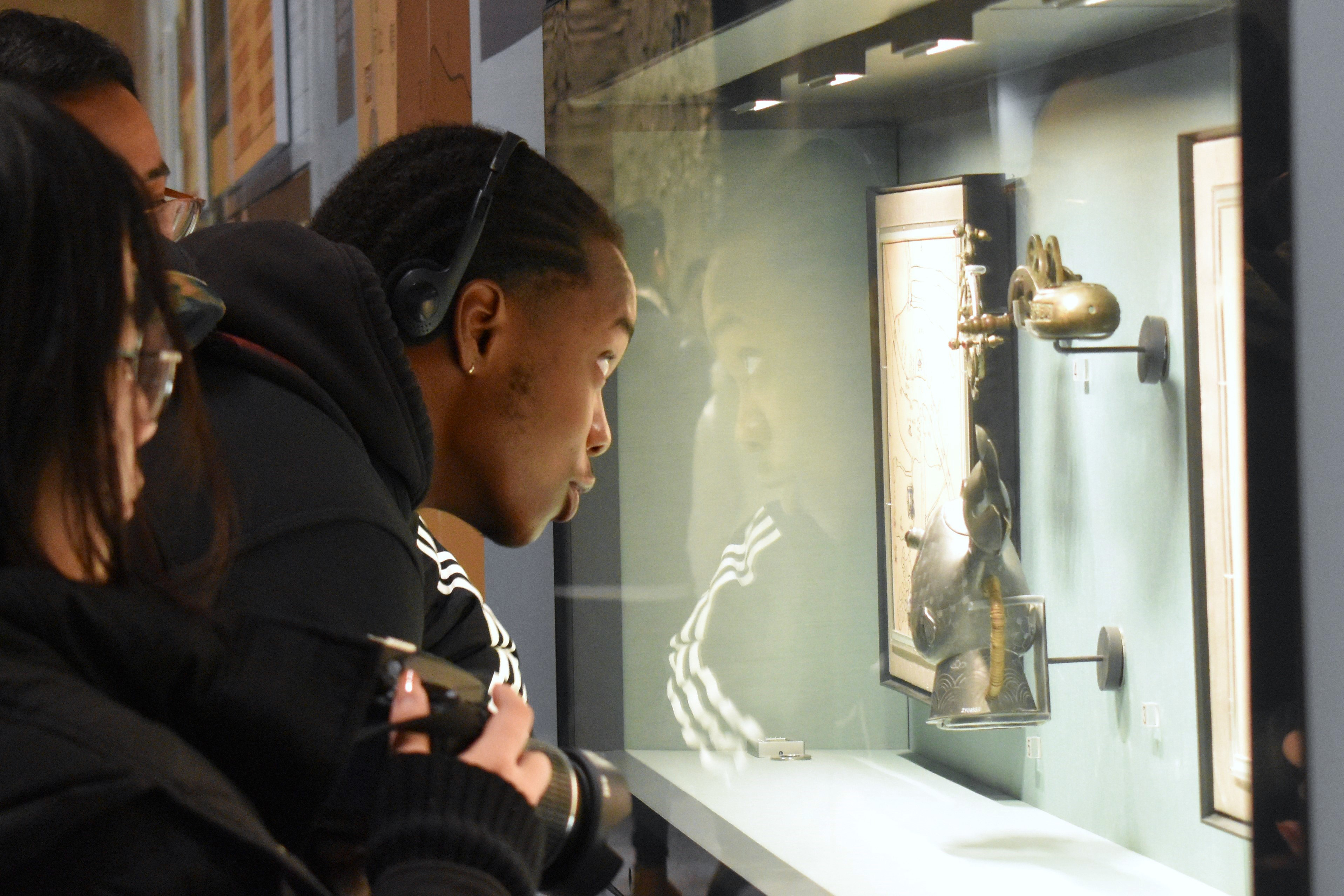 Clayten Thomas, a DSU senior Pre-Law major, examines an exhibit at the Grand Canal Museum in China. 