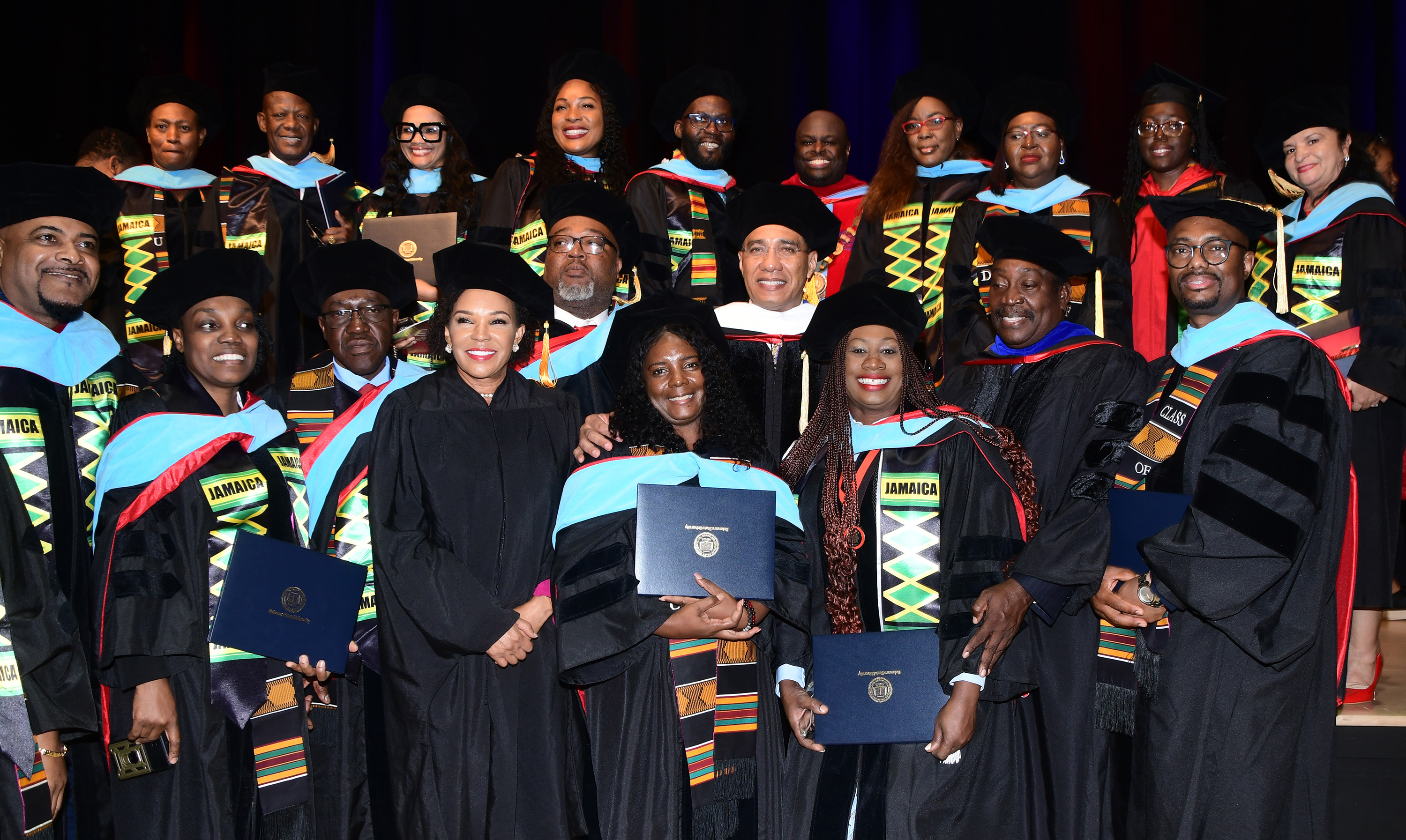 Jamaican graduates of the Educational Leadership Program pose with Jamaican Prime Minister Andrew Holness at Commencement. 