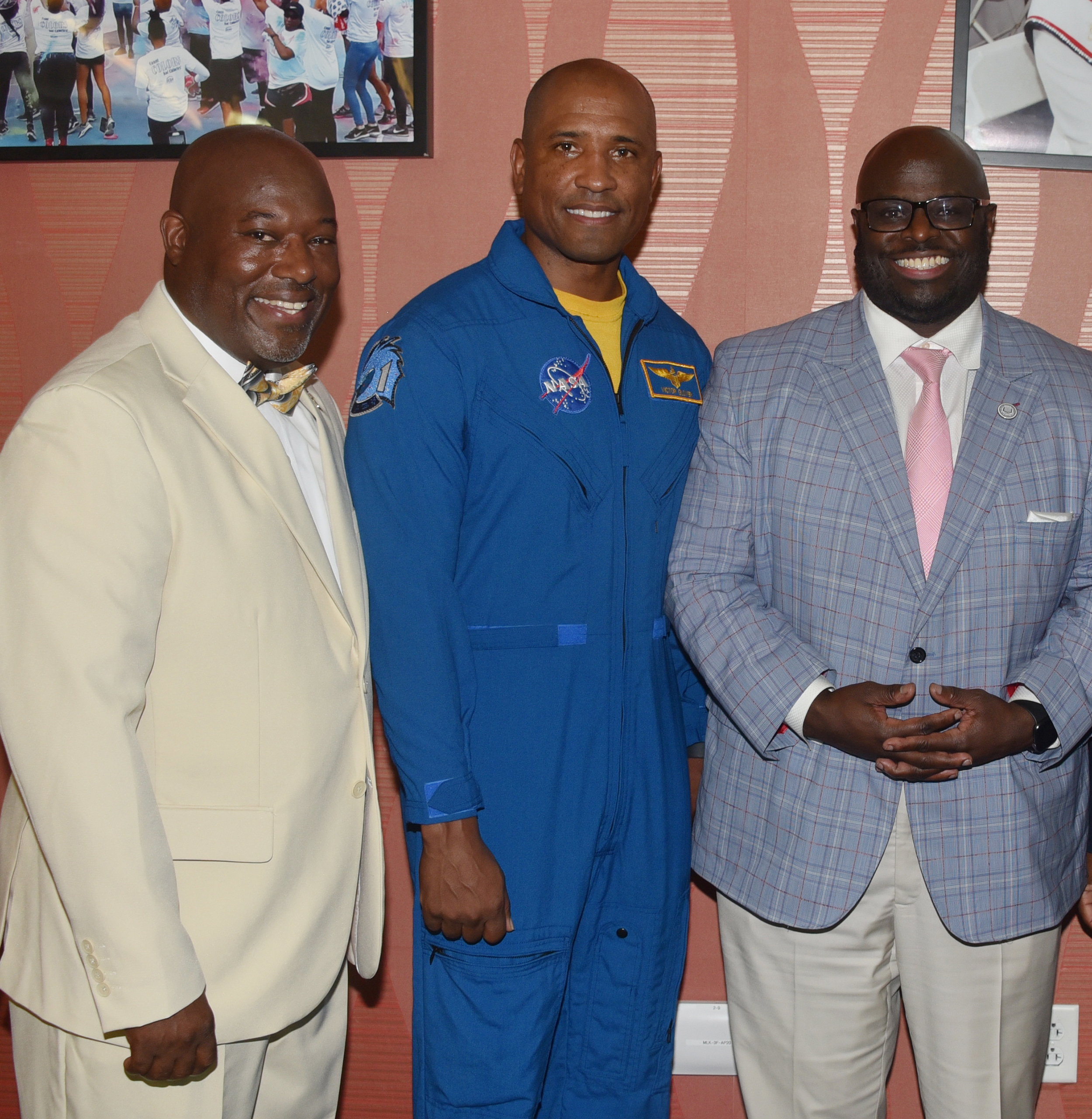 Aviation Program director Lt. Col. Michael Hales, Cmdr. Victor Glover, and University President Tony Allen