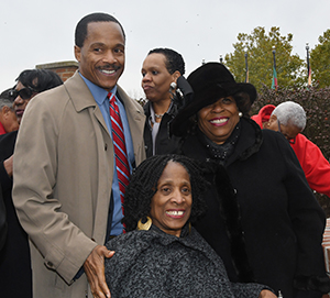 Dr. Holland son and daughter, Joseph Holland and Lucy Holland-Harden with University President Wilma Mishoe.