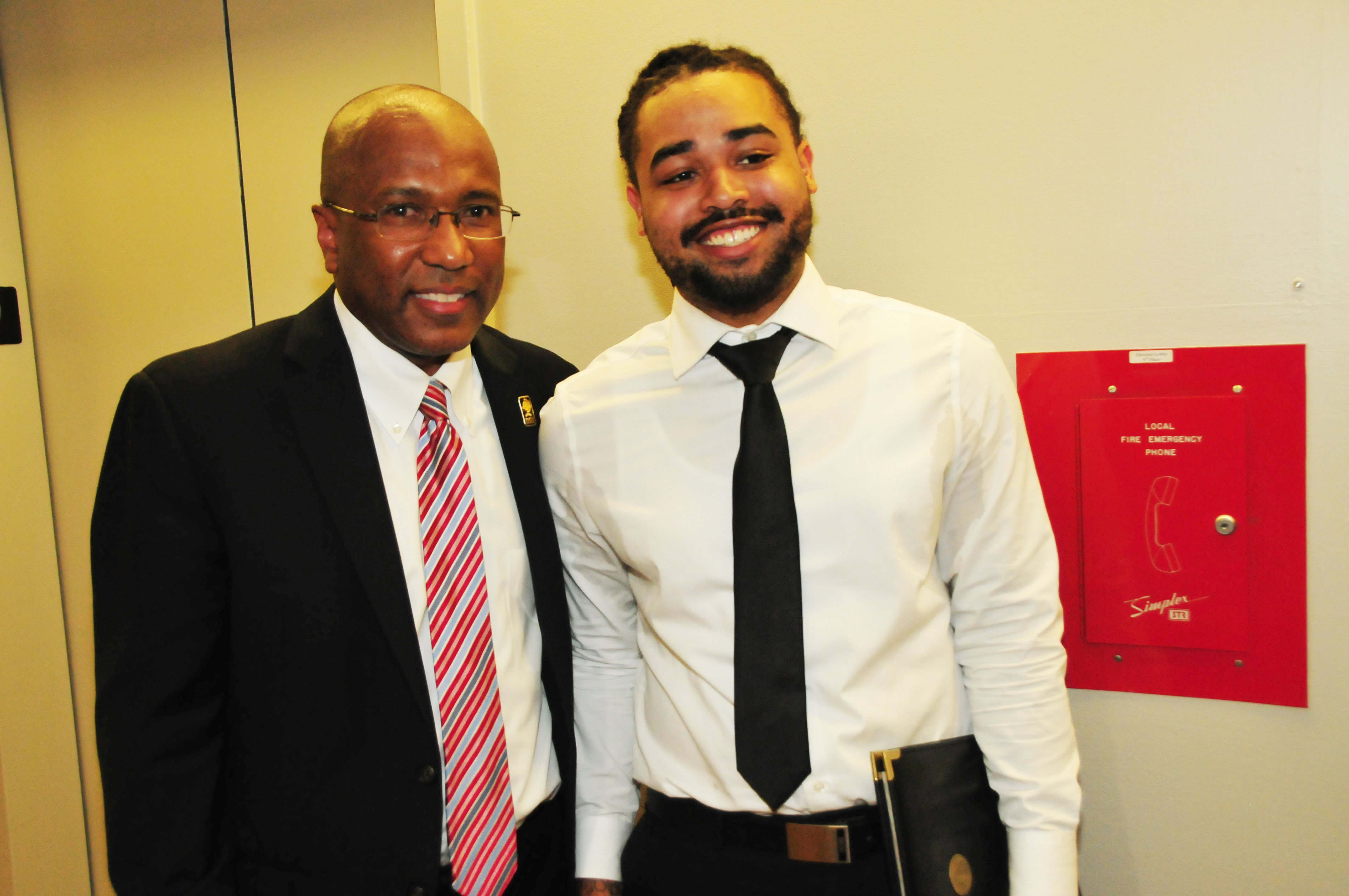 DSU President Harry L. Williams stands with DSU undergraduate Jeffrey Revel, who will be an intern working to help the city.