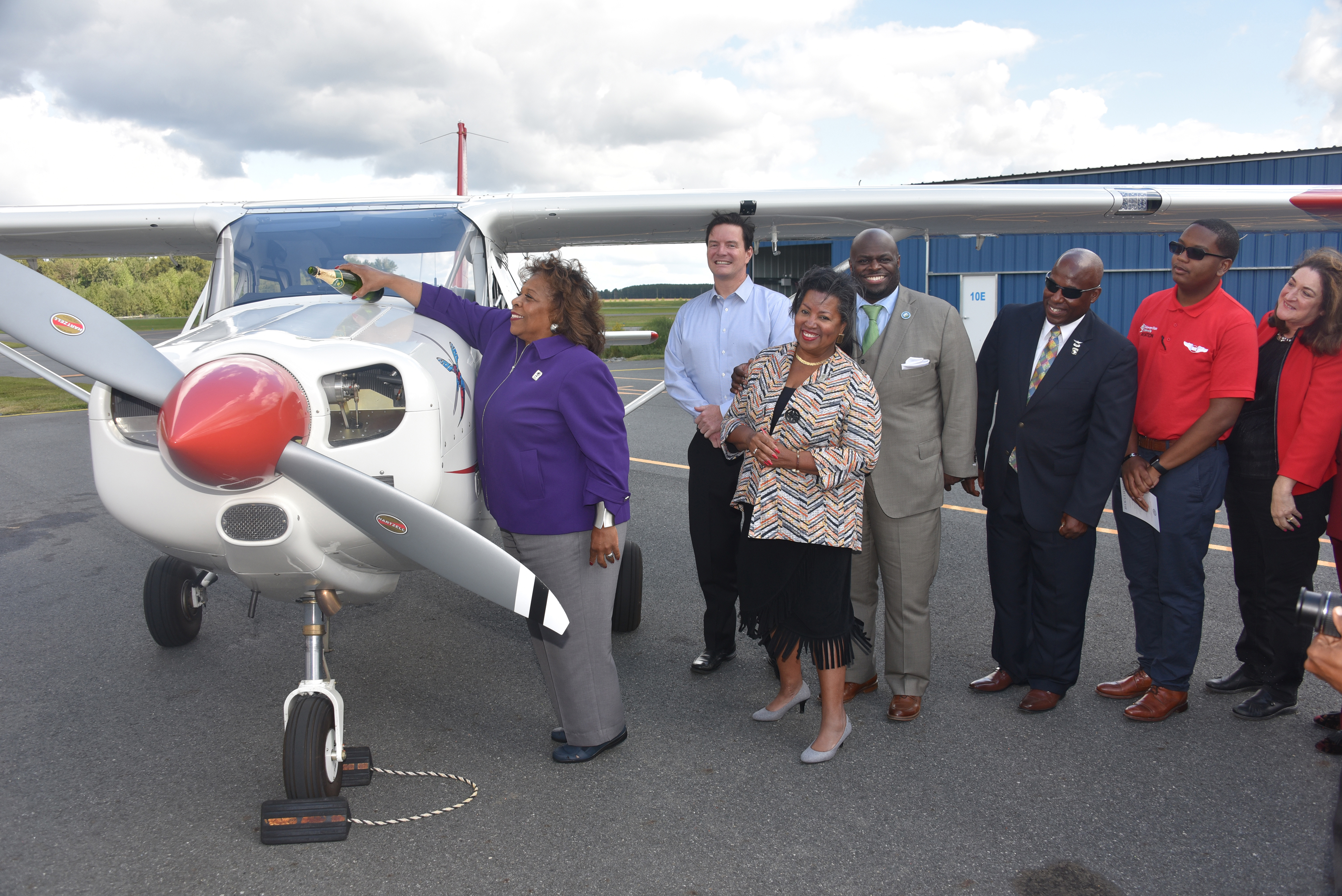 University President Wilma Mishoe christens the Aviation Program's newest aircraft, which is the first of a new 11-plane fleet that is slated to be delivered soon.