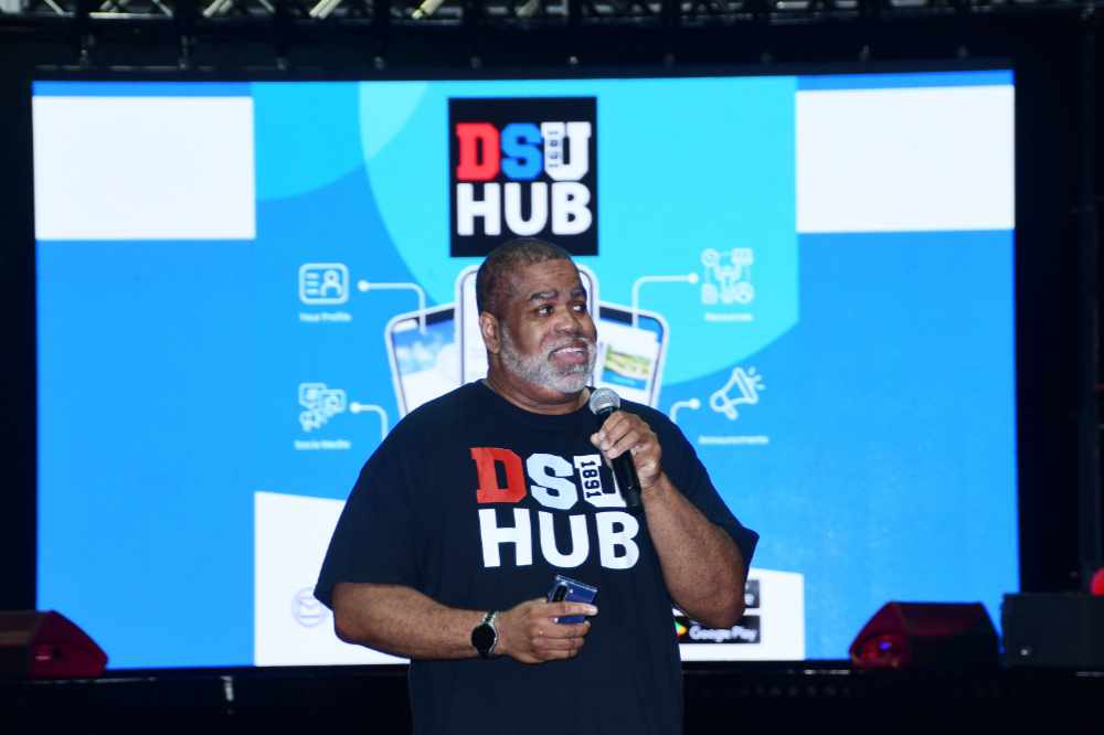 Curtis Winslow, DSU Associate Director of Mobile and Web Application Development, explains the DSU Hub app during the Freshmen Orientation session in the Memorial Hall Gymnasium during Welcome Week. Mr. Winslow developed the DSU Hub app.