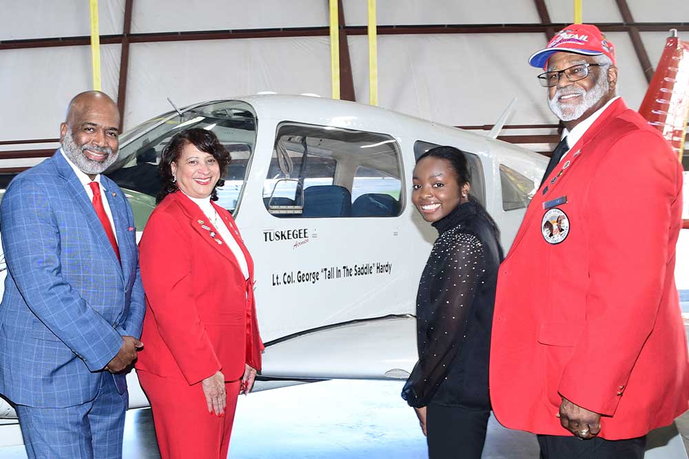 (L-r) Retired Brig. Gen. Robert D. Bowie and Dr. Joi Spraggins, Board Chairman and Founder/CEO of Legacy Bridges STEM Academy Inc., respectively; Soledad Quaninoo; and Legacy Bridges Board Member Andrew Holloway all pose at DSU's Piper Arrow aircraft that now bears the name of Lt. Col. George "Tall in the Saddle" Hardy, who was a WWII pilot for the legendary Tuskegee Airmen.