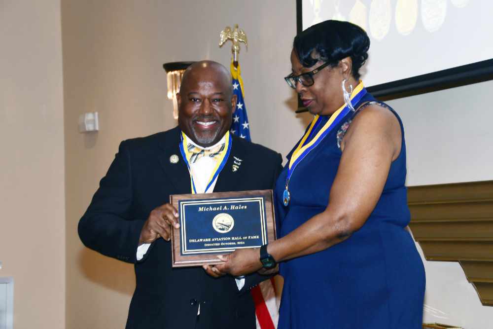 Lt. Col. Michael Hales receives his induction into the Delaware Aviation Hall of Fame from LeSans Alexander, Chair of that organization's Board of Trustees. Lt. Col. Hales was recognized from his 25-year career as a U.S. Army aviator and for his seven years as the Director of the DSU Aviation Program.