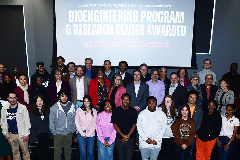 A group representing faculty from DSU, University of Delaware, and Rowan University, as well as DSU students gather for a photo after the announcement of the $7 million  bioengineering grant award during a Nov. 21 program in the MLK Jr. Student Center. The seven-year research project will involve all three universities, with DSU being the lead institution.