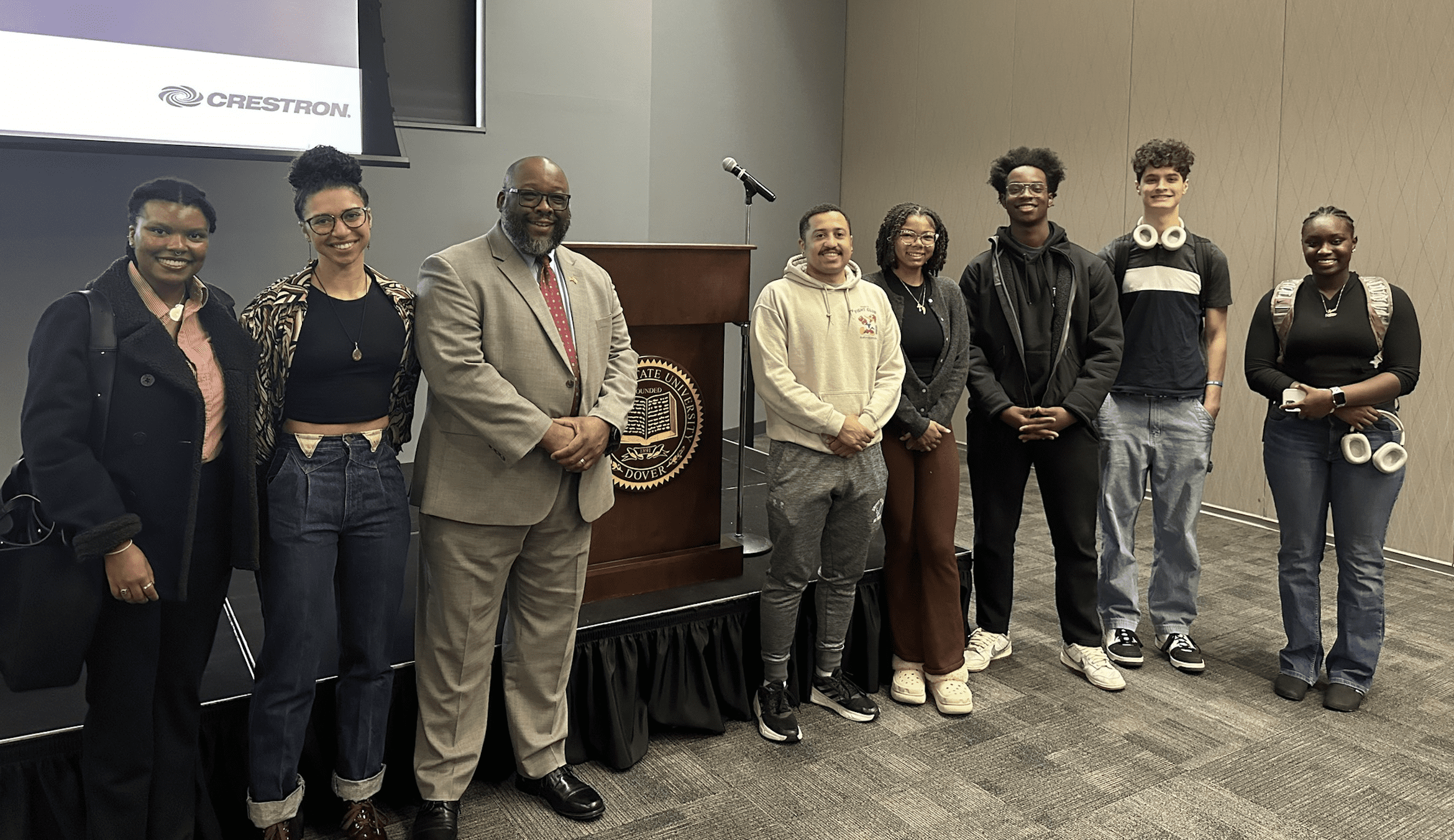 Ambassador Arthur Brown (tan suit) with DSU students.