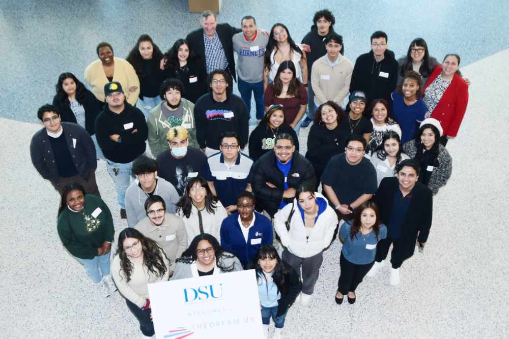 A group of the DSU Dreamers pose for a photo with officials of TheDream.US. The group had lunch in the Martin Luther King Jr. Student Center on Dec. 3.