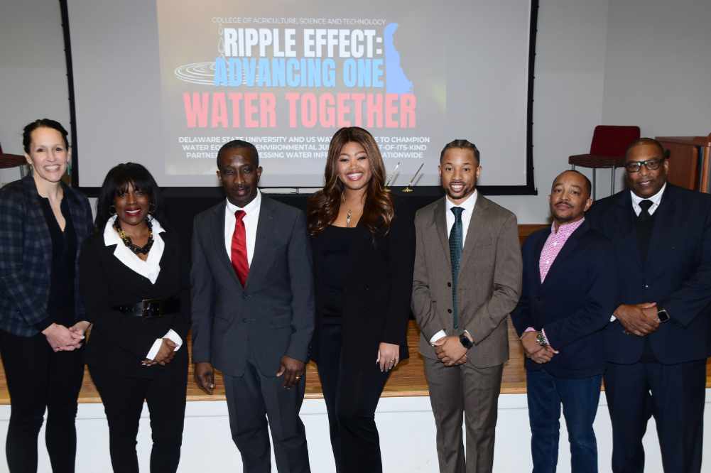 (L-r) USWA Chief Strategy Officer Renee Willette, DSU CAST Dean Cherese Winstead, Andrew Sawyer of the EPA's Office of Water, USWA Program Manager Maura Jarvis, DSU Program Manager Jason Nunley, College of Humanities, Education & Social Sciences Associate Dean Kimeu Boynton, and College of Business faculty member Wade Robinson gather for a photo before the DSU-US Water Alliance partnership event.