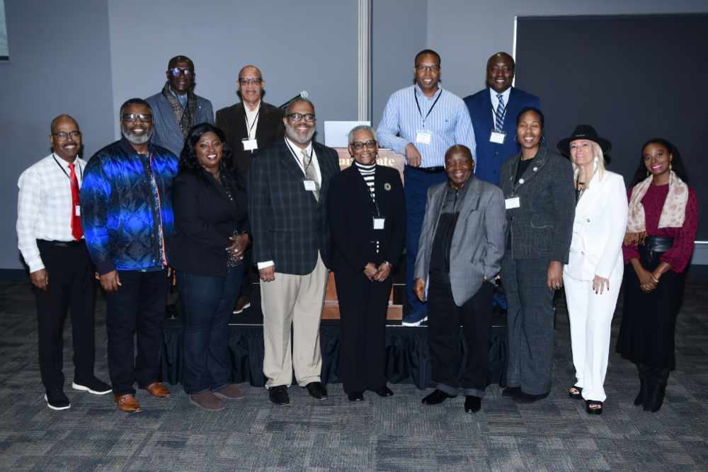 Dr. Raymond Tutu (top row, far right) poses with pastors and church leaders from faith-based organizations who collaborated with him on a research project to determine the level of health literacy in the First State.