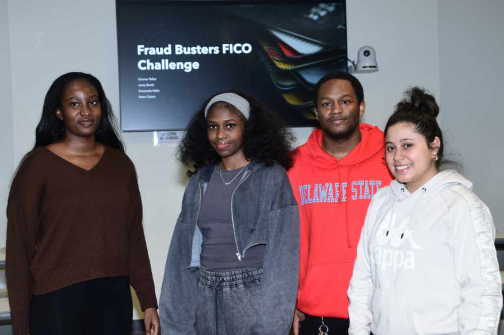 "The Fraud Busters" -- The first-place team in the FICO Analytics Challenge Competition. The winning team members -- (l-r) Emanuela Halm, senior Business Analytics major; Keon Caison, senior Accounting major; Jenia David, senior Accounting major; and Giomar Tellez, senior Accounting major -- each won $1,500 for their first-place performance.