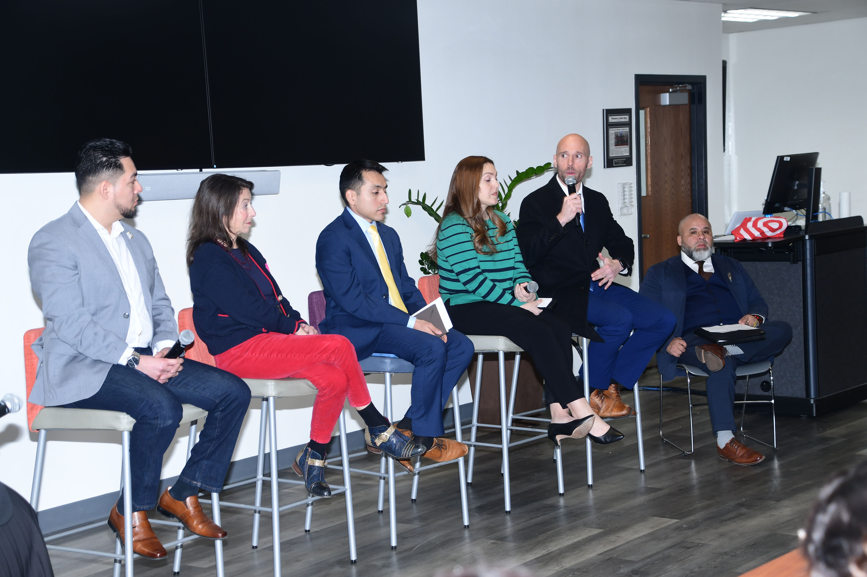 (L-r) Miguel Nuñez, Mary DuPont, Rony Baltazar-Lopez, Christy Gonzelez, Seth Lupton Esq. (with microphone), and Iz Balleto, brought their diverse background and capacities to share their perspectives at the Hispanic panel discussion "Voices of Empowerment" held in the Bank of America Building on the DSU campus. 