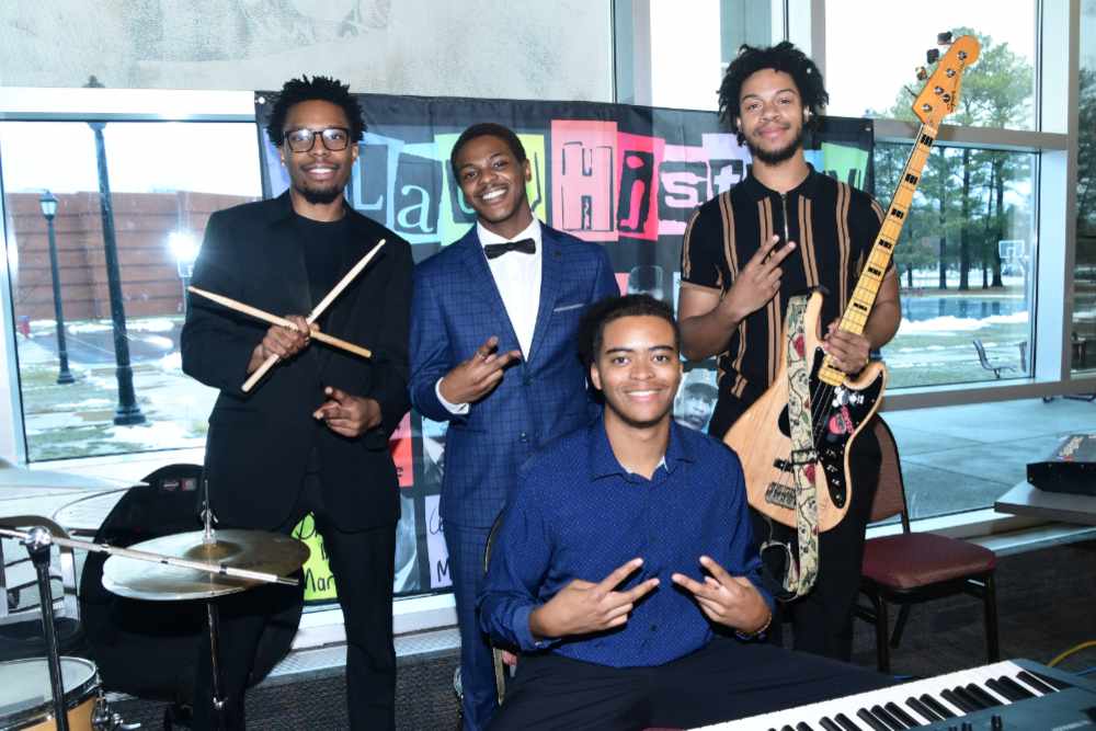 The musical group "222 & Friends" -- (standing) original members Zion Brown, Zuri Brown, Asad Williams; (seated) Isaiah Brooks (friend participant in the Feb. 13 performance).