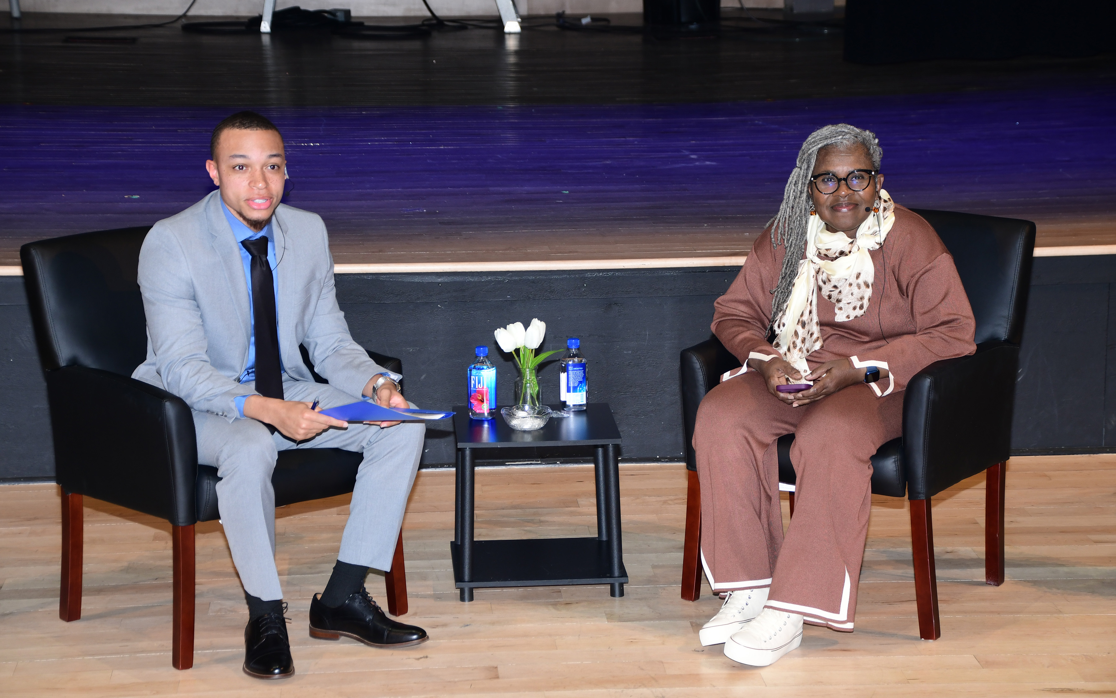 Jordan Cole (l), a senior Mass Communication major, conducts a "Fireside Chat" with guest speaker Capt. Theresa Claibourne, the first Black female pilot in the U.S. Air Force. Capt. Claibourne was a guest speaker in the Dr. William B. DeLauder Education & Humanities Theatre as part of Women's History Month.